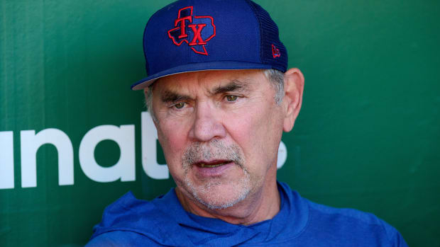 Texas Rangers manager Bruce Bochy talks with the media in the dugout before a game against the Oakland Athletics at Oakland-Alameda County Coliseum. (2023)